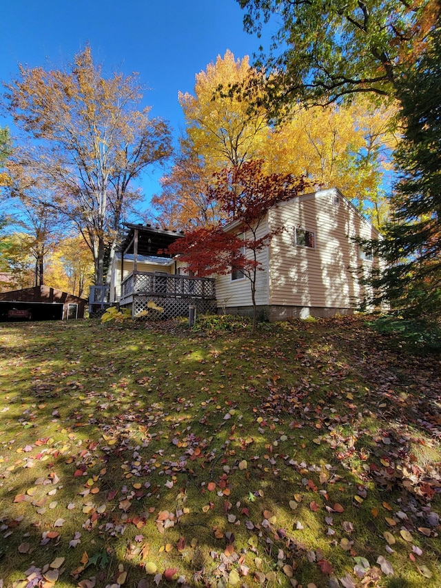 view of yard with a wooden deck