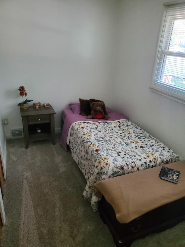 carpeted bedroom with visible vents