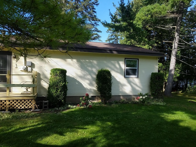 view of property exterior featuring a yard