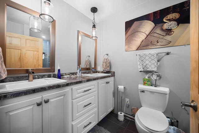 full bathroom featuring tile patterned flooring, double vanity, toilet, and a sink