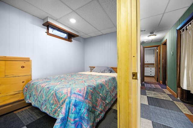 bedroom with a paneled ceiling