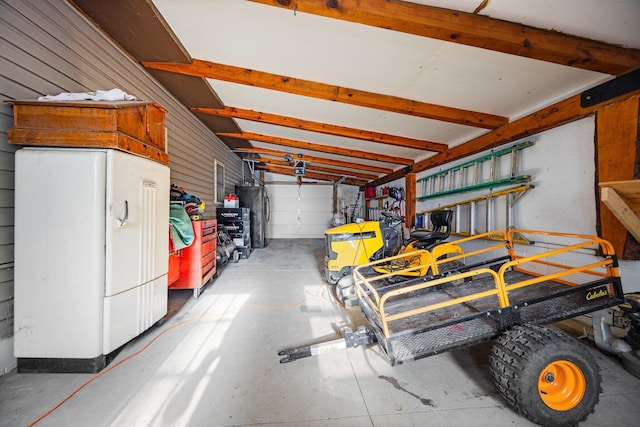 garage with water heater and fridge