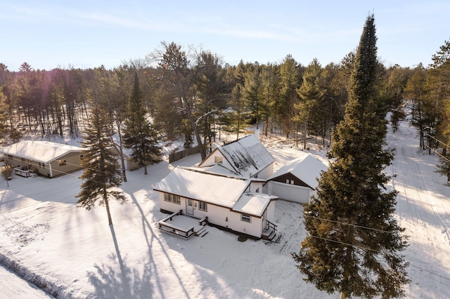 drone / aerial view with a wooded view