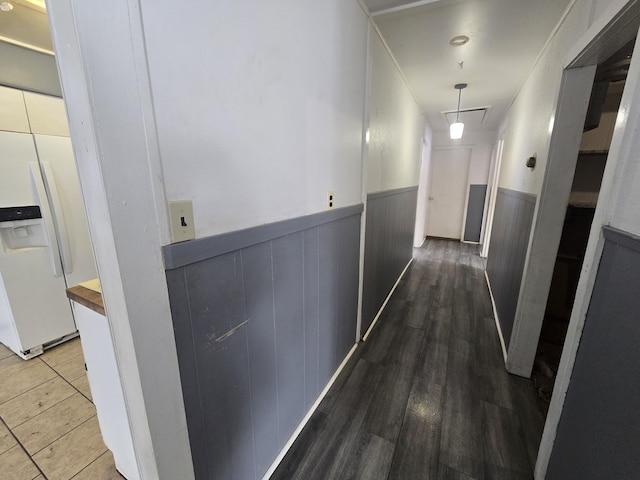 corridor with a wainscoted wall