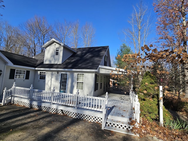 view of front of home featuring a wooden deck