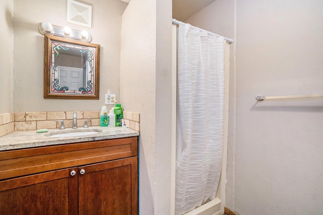 bathroom with visible vents, vanity, and a shower with curtain