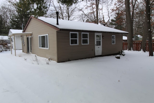 view of front of house featuring fence