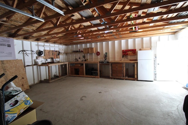 garage featuring freestanding refrigerator