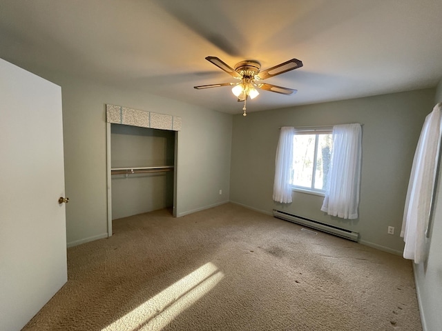 unfurnished bedroom featuring baseboards, carpet floors, ceiling fan, a closet, and a baseboard heating unit