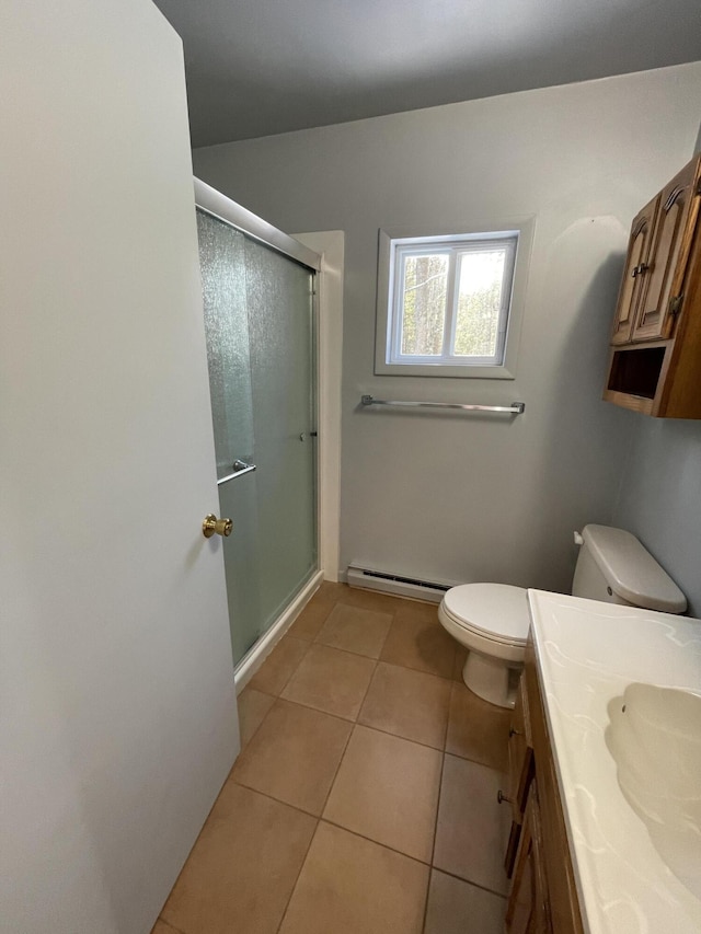 full bathroom with a baseboard heating unit, toilet, a stall shower, tile patterned floors, and vanity