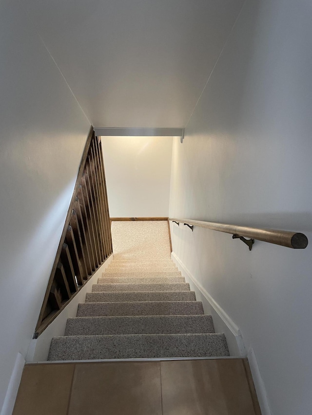 staircase with baseboards