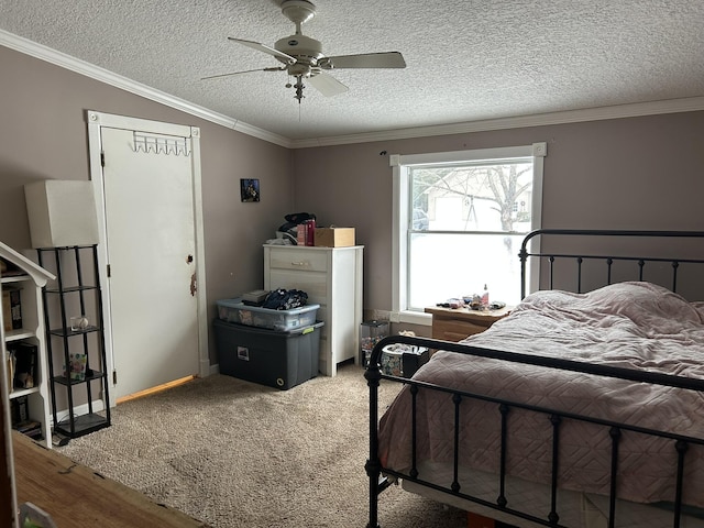 bedroom with carpet floors, a textured ceiling, and crown molding