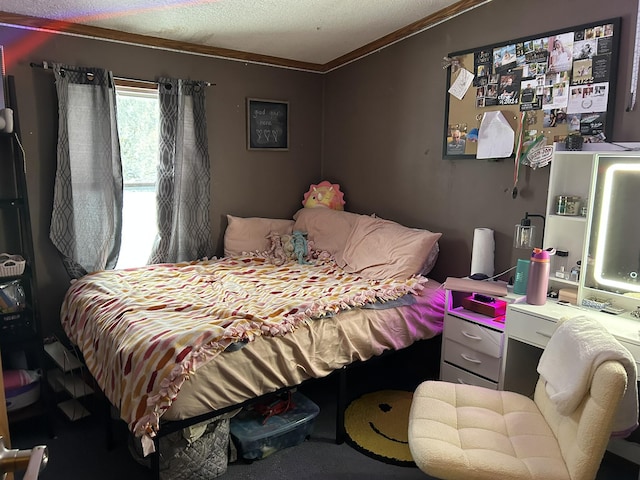 bedroom with a textured ceiling and crown molding