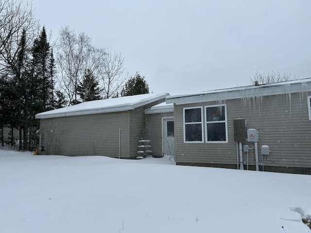 view of snow covered house