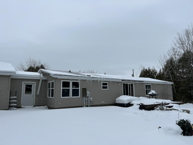 view of snow covered house