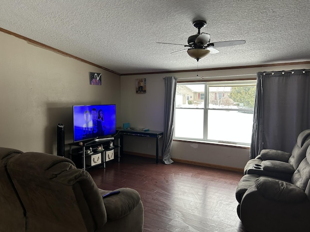 living room with wood finished floors, ceiling fan, ornamental molding, vaulted ceiling, and a textured ceiling