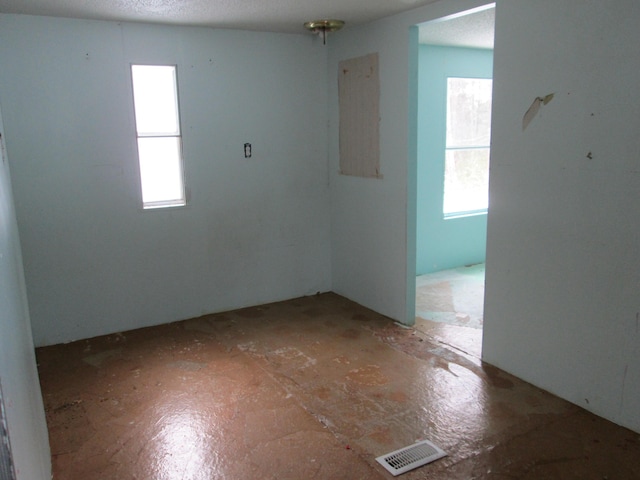 spare room featuring visible vents