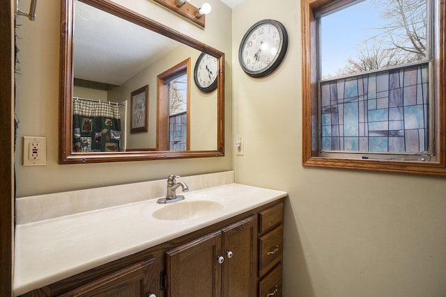 bathroom with vanity and a healthy amount of sunlight