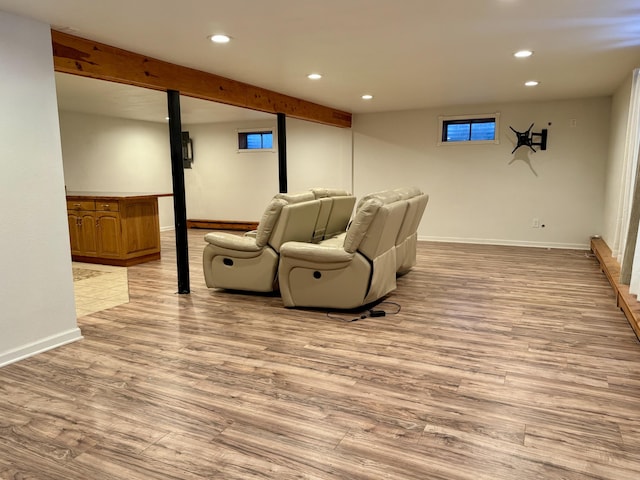 living area featuring beamed ceiling, recessed lighting, baseboards, and wood finished floors