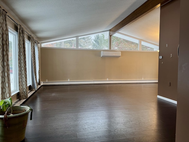 interior space with dark wood finished floors, a textured ceiling, a wall mounted air conditioner, and lofted ceiling with beams