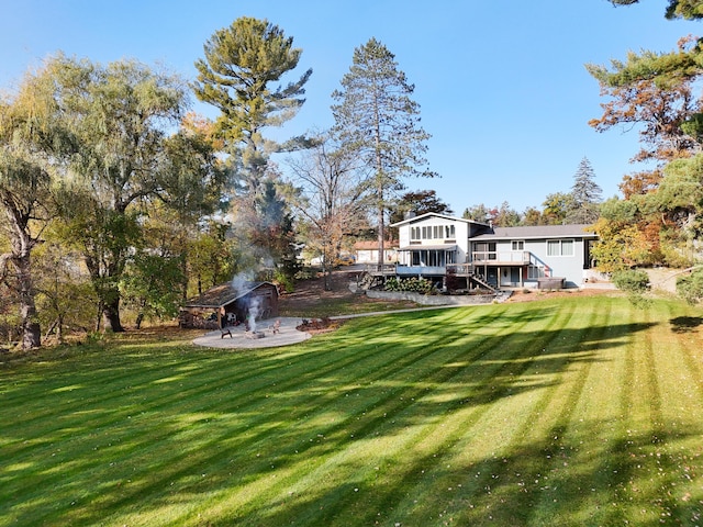 view of yard with a gazebo and a wooden deck