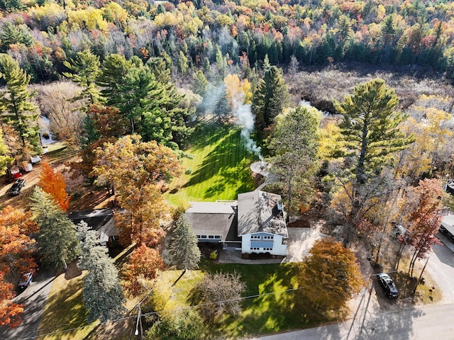 birds eye view of property with a wooded view