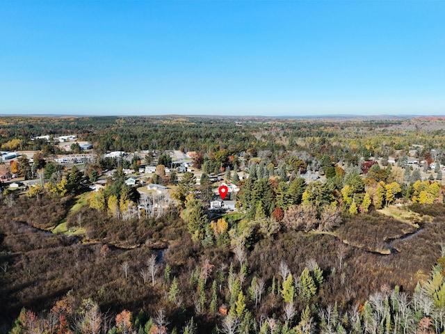 aerial view featuring a wooded view