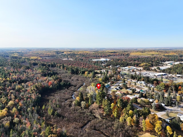 drone / aerial view featuring a view of trees