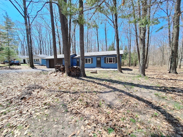 single story home with an attached garage and driveway