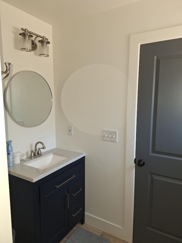 bathroom with vanity and baseboards