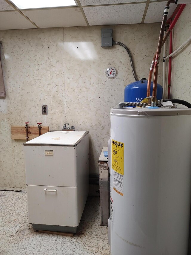 utility room featuring water heater