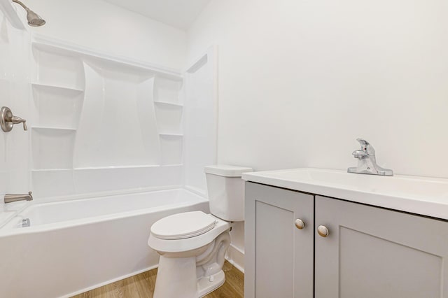 full bath featuring vanity, shower / bathing tub combination, toilet, and wood finished floors