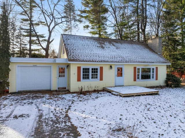 view of front of house featuring roof with shingles, a chimney, a deck, and an attached garage