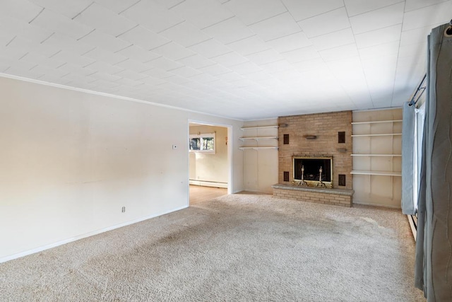 unfurnished living room with a fireplace, carpet, baseboard heating, and ornamental molding