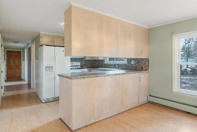 kitchen with white appliances, light wood-style flooring, light brown cabinetry, a sink, and baseboard heating