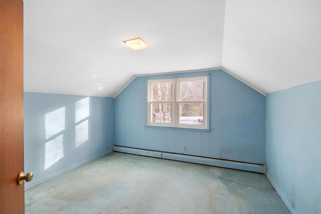 bonus room featuring carpet floors, baseboards, lofted ceiling, and a baseboard radiator