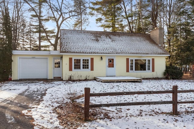 view of front of property with a wooden deck, a chimney, a garage, and roof with shingles