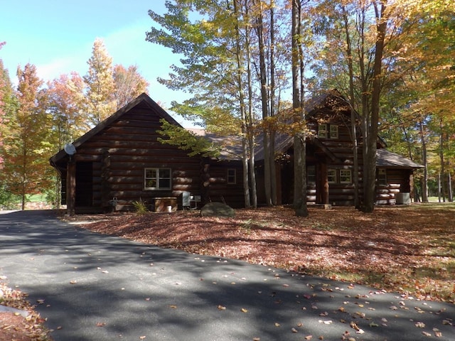 view of side of property with log exterior