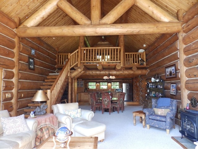 living area featuring beamed ceiling, high vaulted ceiling, carpet, wood ceiling, and a wood stove