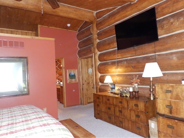 carpeted bedroom with visible vents, wooden ceiling, and vaulted ceiling with beams