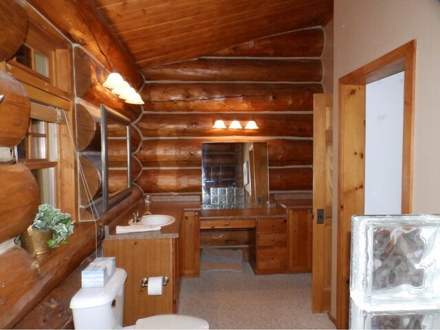 bathroom featuring wooden ceiling, toilet, vanity, and lofted ceiling