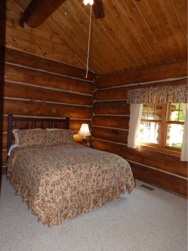 carpeted bedroom with visible vents, log walls, vaulted ceiling with beams, ceiling fan, and wood ceiling