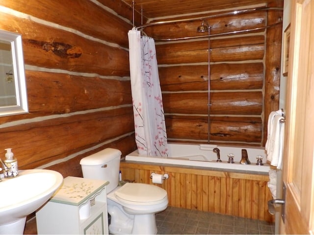 bathroom with a sink, log walls, toilet, and shower / tub combo