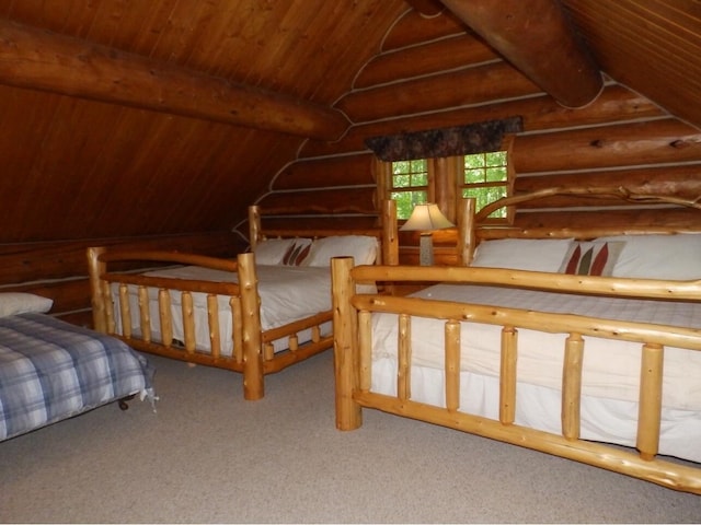 bedroom with carpet flooring, vaulted ceiling with beams, and wood ceiling