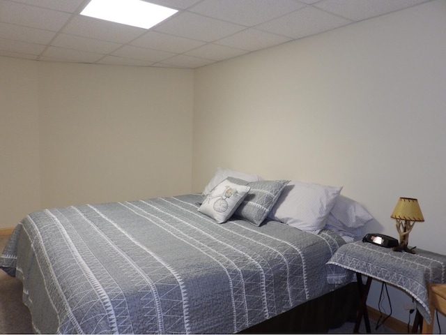 bedroom featuring a paneled ceiling