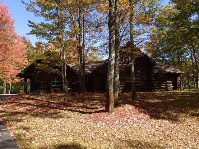 view of property exterior featuring log exterior