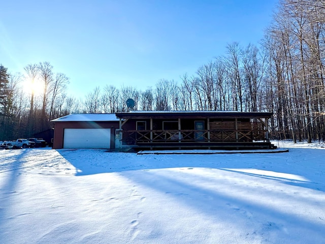 view of front facade featuring a porch and an attached garage