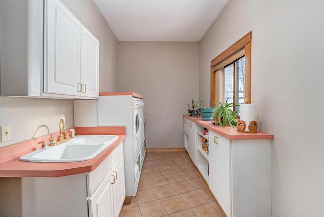 5560 Chestnut Dr, Cheboygan, MI 49721 - laundry area featuring cabinet space and light tile patterned floors