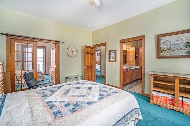 5560 Chestnut Dr, Cheboygan, MI 49721 - bedroom with dark carpet, ensuite bathroom, a ceiling fan, and baseboards