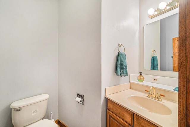 5560 Chestnut Dr, Cheboygan, MI 49721 - bathroom with toilet and vanity